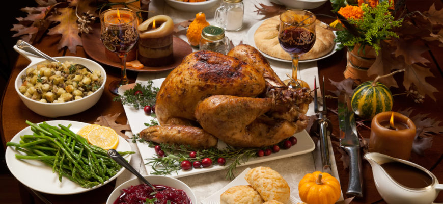Roasted,Turkey,Garnished,With,Cranberries,On,A,Rustic,Style,Table